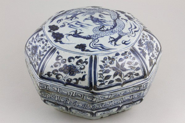 Chinese Blue and White Octagonal Box: Blue and White Box, China, the octagonal form decorated with ruyi motifs and leiwen border, the cover with dragon amidst clouds, surrounded by panels depicting auspicious flowers, mark on base, 10" x 