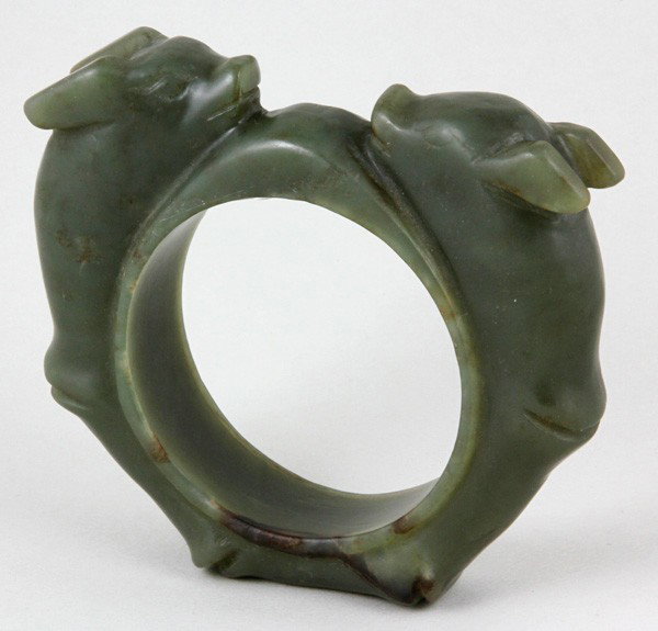 Chinese 19th/20th C. Jade Ornament: Jade Bangle, China, 19th-20th century, carved as a pair of chi-dragons forming a circle, 4 1/4".