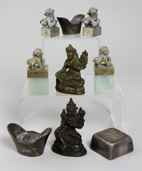 Nine Chinese Small Items: Nine Small Items, China, including two Buddhist figures, four seals each surmounted by a foo lion, and three weights.