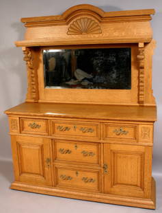 19TH CENTURY CARVED OAK SIDEBOARD, MIRRORED TOP: 19th Century carved oak sideboard with mirrored top, 77 1/2"h. x 60 1/2"w. x 35 1/2"d. Good condition.