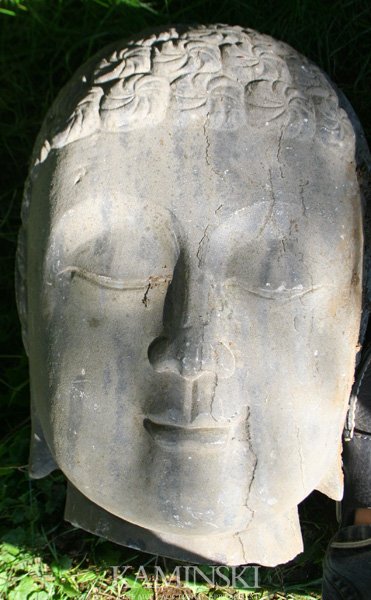 Stone Buddha Head: Head of Buddha, stone, 14"h x 9"w. Age crack and surface scratches.