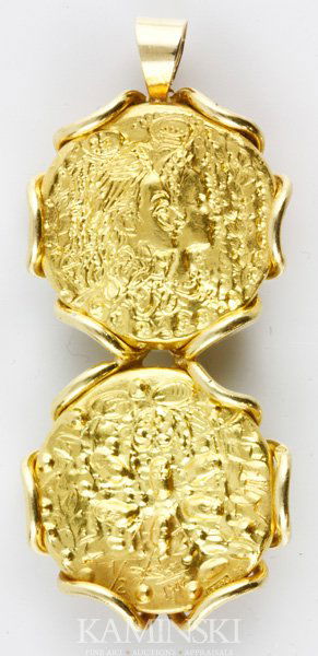 22K Gold Piaget Coin Pendant: 22K yellow gold piaget Salvador Dali double coin pendant, 1 3/4"h x 3/4"w, approximately 0.7 oz/13 dwt tw.