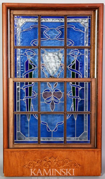Stained Glass Window: Stained and leaded glass window in window sash frame, upper panel 21 1/2" x 26 1/2", lower panel 21 1/4" x 26 1/2", frame 58 1/2" x 33 3/4". Sash operates.
