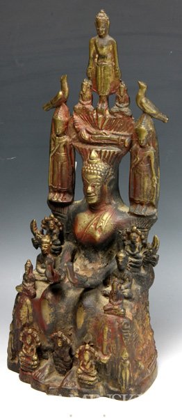 19th C. Bronze Buddha: Seated Buddha, Southeast Asia, 19th century, decorated with gilt and paint, with Bodhisattvas and birds on all sides, the reverse carved with Buddhist figures in spiraling motifs and small niches, bro