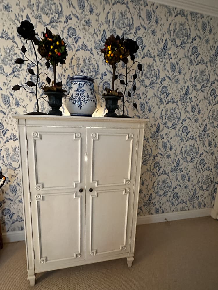 Cabinet, Tole Flowers, Terra Cotta Jug, Topiaries: Painted cabinet, 36" H x 26" W x 19 1/2" D; pair of tole flowers, 23"; Italian terra cotta jug, 15" x 10"; pair of topiaries. Lot of (6). Provenance: Palm Beach, Florida estate.