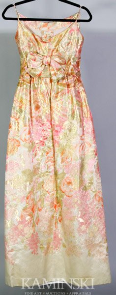 French Evening Gown: "Made in France" labeled evening gown, multi-color silk to include pink, orange, green with metallic gold threading in floral design, a-line, large bow on front, skirt is lined, bodice has built-in co