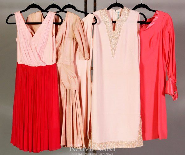 5 Pink Dresses: Five Dresses in varying shades of pink to include: a Gino Paoli shift dress with sequin detail at neckline and hem, wool, size 14; a long sleeve shift dress with oversized cuffs and rhinestone cuff li