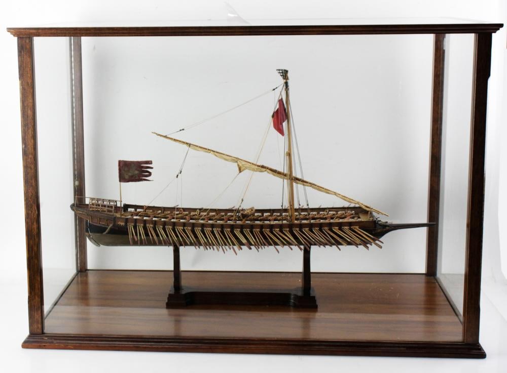 Antique Cased Wooden Slave Ship Model: Antique cased wooden model of a slave ship, ship 32" x 15", case 25" H x 36" W x 19" D. Provenance: Ipswich, Massachusetts collection.