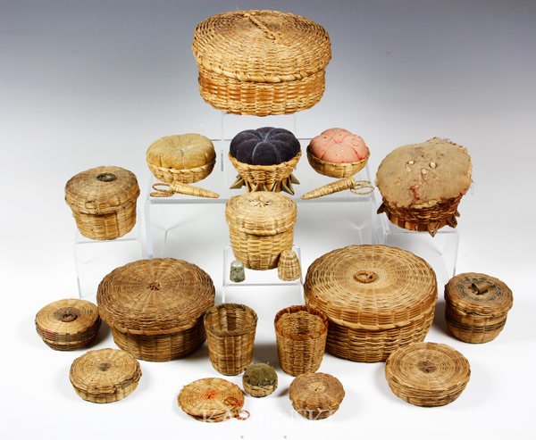 Lot of Penobscot Tribe Basket Items: Lot of early 20th century Penobscot tribe split ash and sweet grass sewing baskets, pin cushions with velvet, needle baskets, etc., 20 items in total, largest basket 6"dia. Some wear.