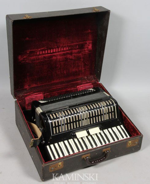 "Ballarini" Accordion: "Ballarini" Italian accordion in case, accordion measures 18 1/2"h x 18"w x 7"d, case measures 21"h x 18"w x 9"d.