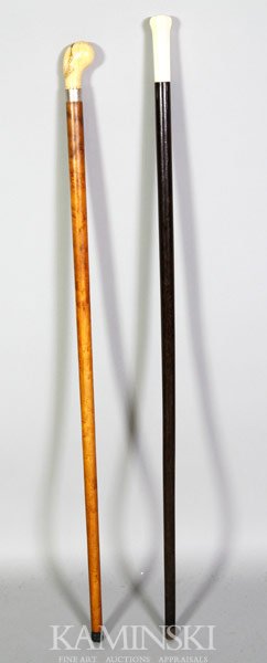 Two Walking Sticks: Two walking sticks, one with walrus ivory handle, maple stick with tapered tip, 35", other with ivory and ebony, 36".