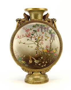 A Rare Japanese Satsuma Moon Flask: The Satsuma moon flask vase, Japan, Meiji period decorated with foo-dog holding ring handles with cherry blossoms, chrysanthemums and birds. Signed Koshida. 12 1/4 inches High. Provenance: From James