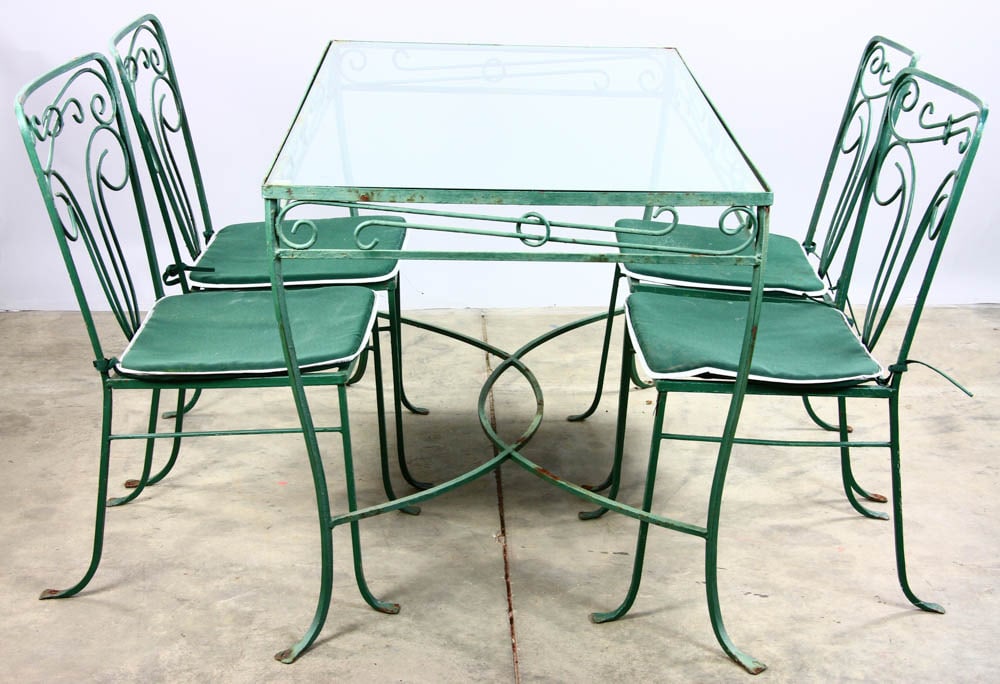 Wrought Iron Garden Patio Set: Wrought iron and mesh garden patio set to include table with glass top and four chairs.