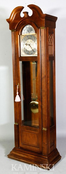 Ridgeway Grandfather Tall Clock: Ridgeway grandfather tall clock with moon phase dial, model 216, circa 1980, with cherry finish, chain driven with German Black Forest movement, metal face with raised brass numerals, has 12 chimes an