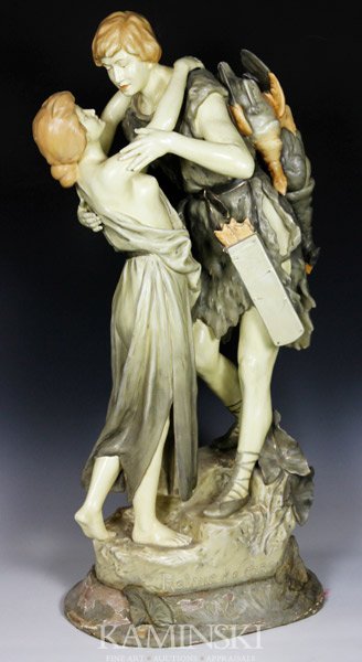 Royal Dux, "Retour de Chasse", Figure Group: Royal Dux, Austrian, "Retour de Chasse", figure group of man and woman embracing, 29"h x 16"w. Paint loss on wood base.
