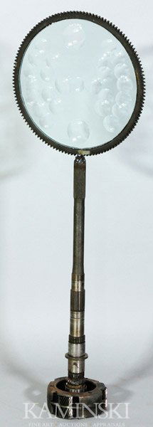 Bejar Magiscope Sculpture: Feliciano Bejar (Mexican American 1920 - 2007), magiscope sculpture, reclaimed steel automotive parts and cut crystal, circular crystal element within ring-gear on base, signed and dated 1982, 32 1/2"