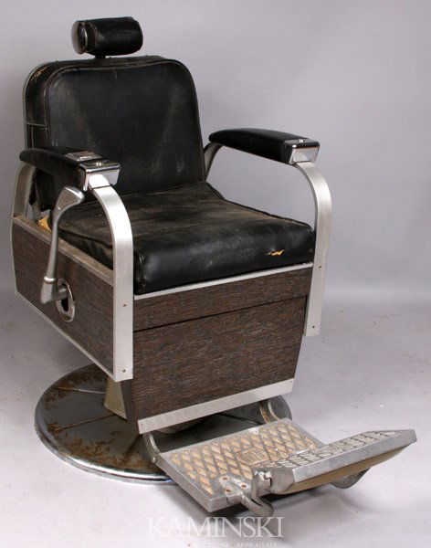 Koken Deco Chrome & Leather Barber's Chair: Art Deco chrome and leather barber's chair by Koken, 42"h. x 26 1/2"w. x 44"d. (including foot rest). Some cracking to leather at corners.