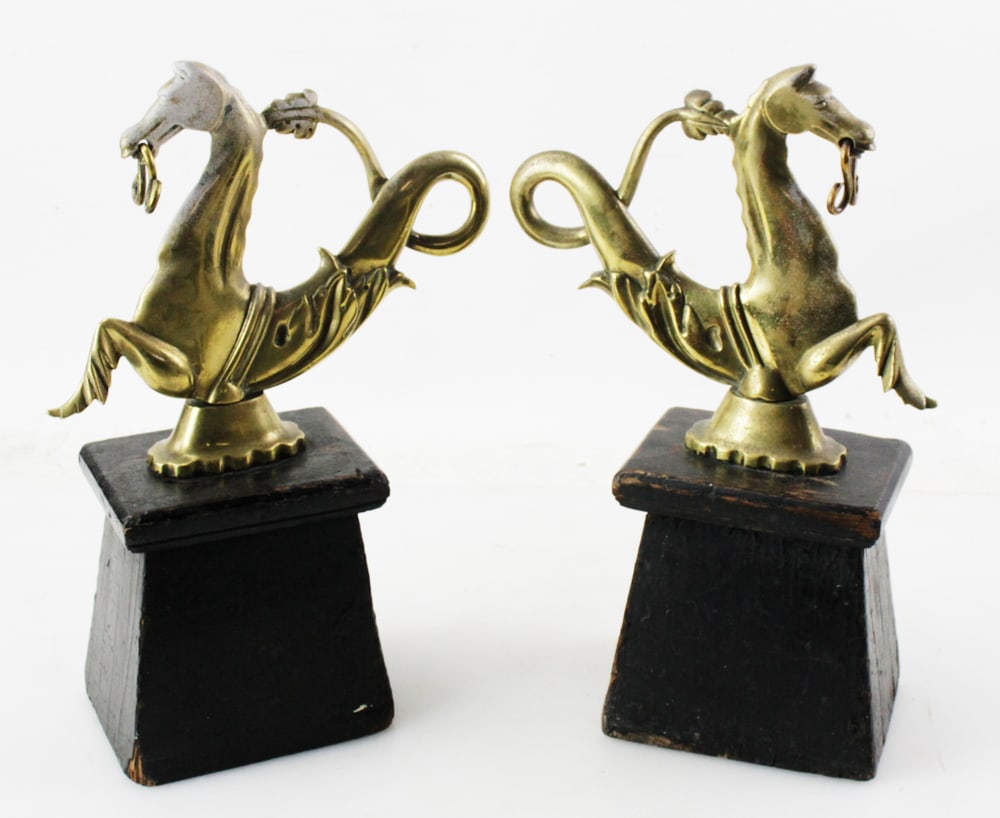 Pair of English Brass Doorstops on Wooden Bases: Pair of English brass doorstops on wooden bases, 14" H x 9 1/2" W. Good condition. Provenance: Estate of Robert Eigelberger, Palm Beach, Florida.