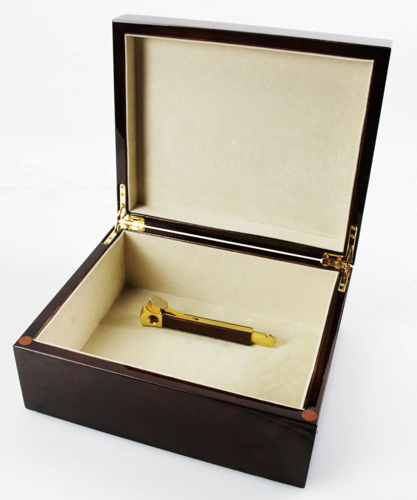 Burlwood Humidor, with Cigar Cutter: Burlwood humidor, with a cigar cutter. Humidor 4 1/2" x 10 1/2" x 9". Good condition. Provenance: Estate of Robert Eigelberger, Palm Beach, Florida.
