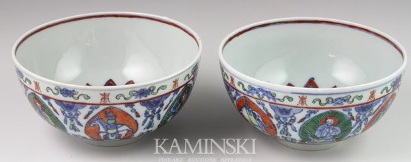 Pair of Republic Period Chinese Bowls: Pair of rice bowls, China, Republic Period, each decorated with a lotus flower at the center, the exterior with Buddhist figures and the Eight Precious Emblems of Buddhism, with a six-character mark o