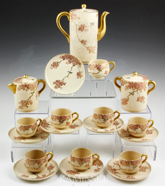 Japanese Satsuma Tea Set: Satsuma tea set, Japan, having blossom and bird design, signed on base, teapot 6" x 3 1/2", saucer 4 5/8".