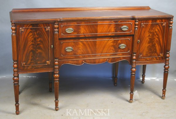 Custom Sheraton Flame Mahogany Sideboard: Custom Sheraton flame mahogany sideboard having fluted legs, Paine Furniture, 38"h. x 65"l. x 21"d.