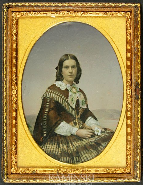 Ambrotype of Young Girl: Ambrotype, 1/4 plate, young girl, all tinted, with gold jewelry and a cameo, holding a white flower, could be Western dress, hall leather case, suitable for hanging, 4 3/4"h x 3 3/4"w.