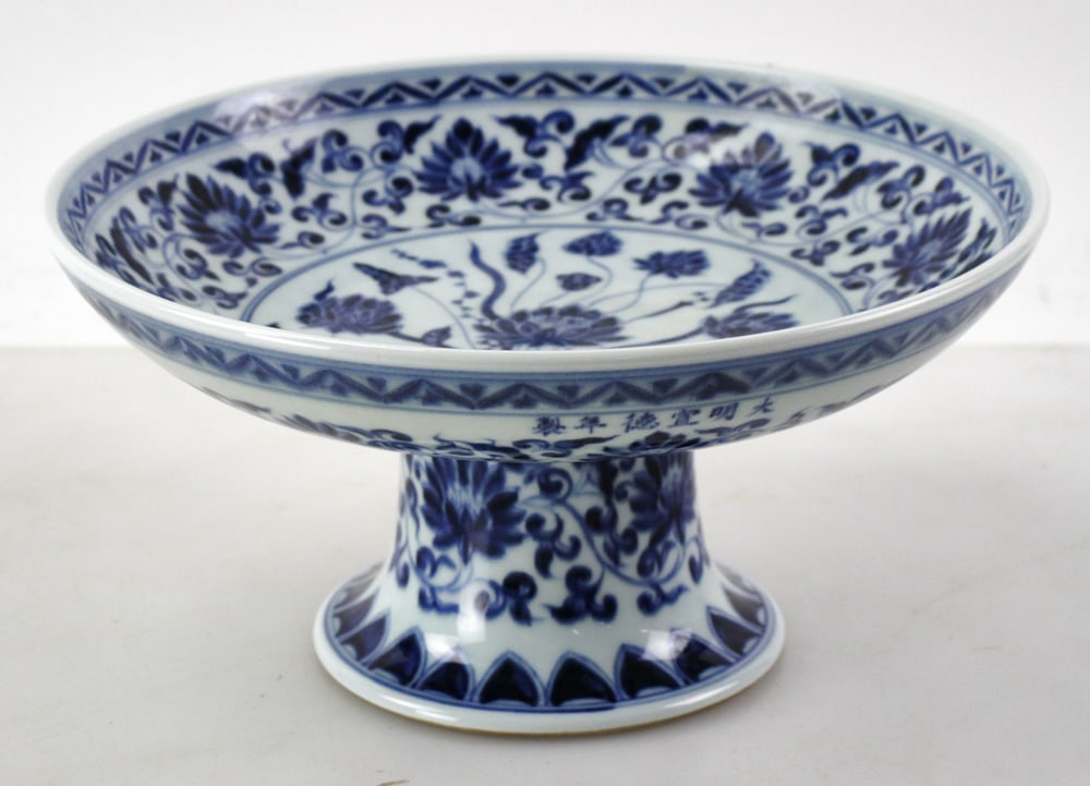 Chinese Blue and White Dish: Chinese porcelain dish with high foot shaped body, 5" H x 10" diameter.