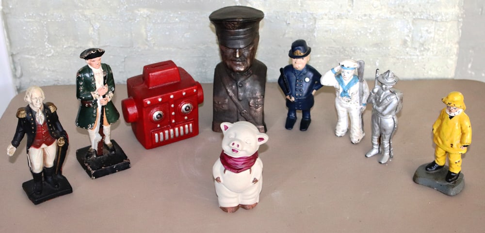 Group of Cast Iron Soldier Doorstops and Banks: Group of assorted cast iron soldier doorstops and banks, including John Wright, (9) total. Provenance: Private Collection, Dover, Massachusetts.