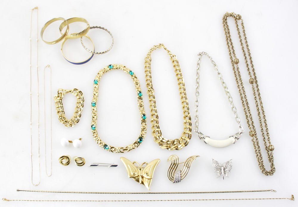 Monet Costume Jewelry: Monet costume jewelry, signed, to include: (4) bracelets, (2) chains, (4) necklaces, (3) pins, (1) pair of earrings. (14) pieces total. Provenance: Acton, Massachusetts collection.