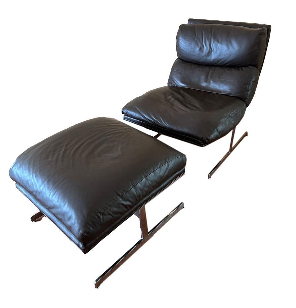 Mid-Century Bernhardt Chair with Ottoman: Mid-century Bernhardt brown leather and steel chair with ottoman. Chair 33" H x 37" W x 27" D; ottoman 18" H x 27" W x 26" D. PLEASE NOTE: THIS LOT WILL BE SOLD IN PLACE, AT 11434 MAUNA KEA LANE, BOYN