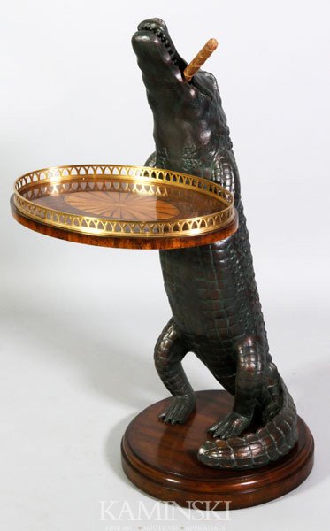 Alligator Tray Table: Interesting tray table featuring an alligator with a cigar in his mouth holding a finely inlaid tray with brass gallery standing on a thick varnished mahogany base, 37” x 18” x 21”.