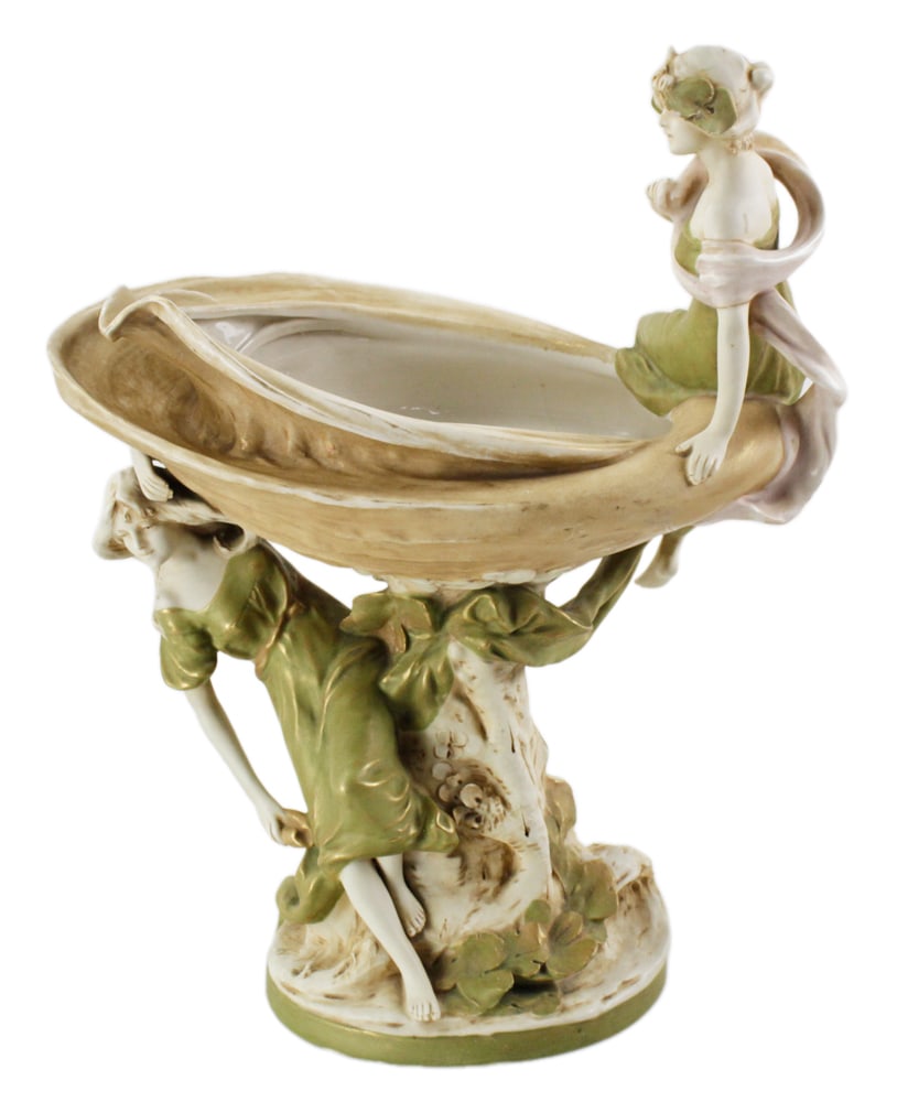Royal Dux Figural Planter: Royal Dux figural planter, 18" H x 13 1/2" W. Cracked base; small chip to leaf on head. Provenance: West Palm Beach, Florida collection.