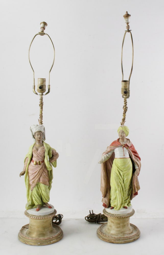 Pair of Porcelain Arab Lamps: Pair of porcelain Arab lamps, statues 14", overall 34" H. Provenance: Boston, Massachusetts collection.