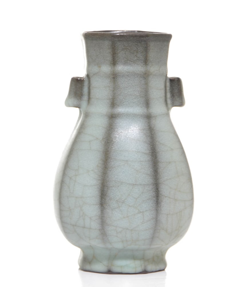 Chinese Guanyao Vase: Vase delicately potted from a short splayed foot and decorated with pair of lug ears, covered overall in an unctuous gray crackled glaze. Possibly Ming dynasty. 7" H (18 cm).