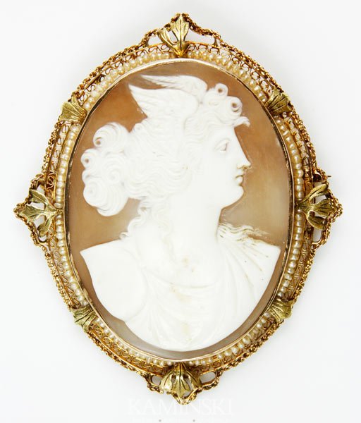 Shell and Seed Pearl Cameo: Ornate shell cameo pin/pendant with seed pearls in a frame of two tones of 10K yellow gold, 2 1/2"h x 2 1/8"w.