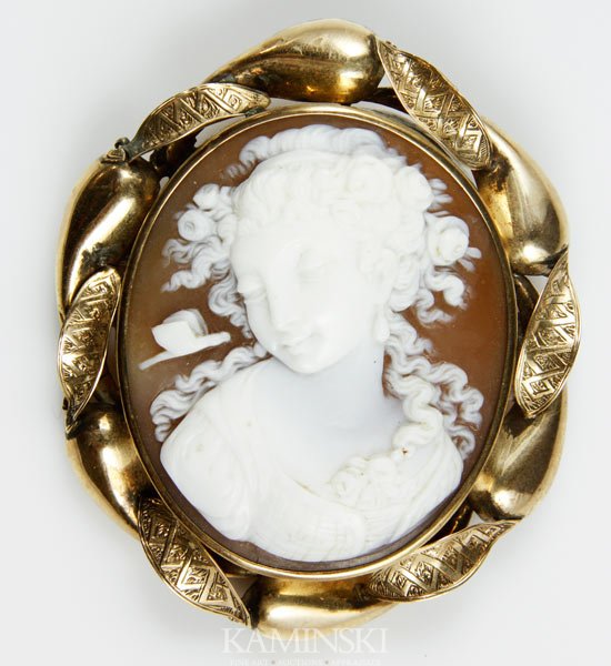 14K Gold and Shell Cameo: 14K yellow gold and shell cameo brooch, 2 1/8"h x 1 7/8"w.