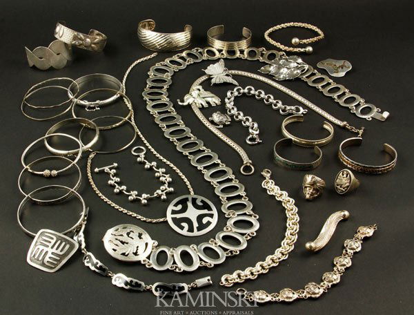Collection of Sterling Jewelry: Collection of sterling jewelry, to include: two rings; two necklaces; one belt, 36 1/2"l; eight pins; five link bracelets; eight bangle bracelets; nine cuff bracelets; approximately 26.6 troy oz TW.