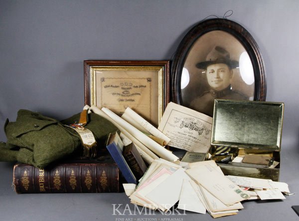 WWI Era Military Items: Large military lot of WWI era items, includes: coat, medals, photographs, family bible, discharge papers, diploma, large amount of correspondence, trench knife; includes several hundred items.