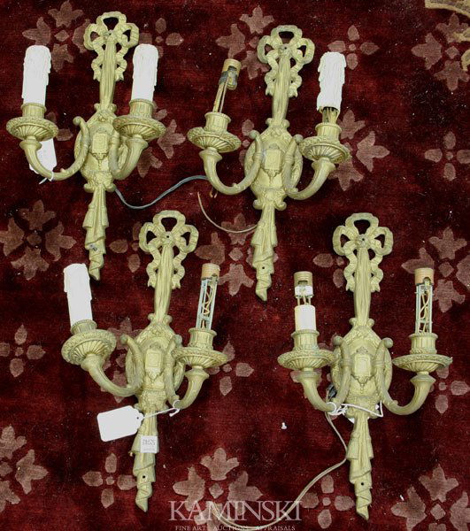 Four (4) Brass Wall Sconces: Set of four (4) brass wall sconces, 19"h. Undamaged; working condition not tested.