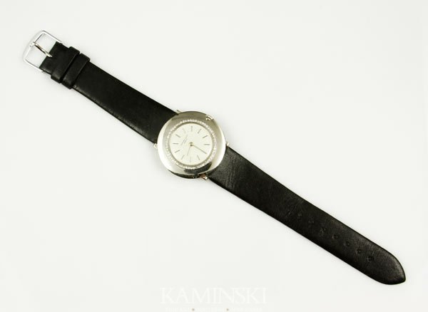 18K Gold Audemars Piguet Wristwatch: Audemars Piquet mans wristwatch, 18K white gold with circular diamond face, approximately .9oz / 16 DWT (including band and movement), 8 3/4"l x 1 3/8"dia (face).