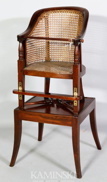 Late 19th C. English High Chair: Late 19th century, English, child's high chair, mahogany with rattan seat and back, removable table and safety bar, adjustable foot rest, 35 1/4" x 16"w x 14 1/2"d.