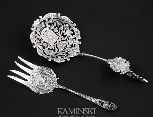 Set of 2 Continental Serving Pieces: Set of two continental serving pieces to include: Dutch ladle hallmarked for sterling in 1910 and engraved "Amsterdam", 9"l, and a silver plate fork likely Dutch having a windmill on the handle, 7 3/4