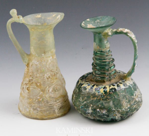 2 8th/9th C. Islamic Glass Jugs: Lot of two circa 8th/9th century A.D. Islamic glass jugs, 4 7/8"h. Provenance: From a New York Collector.
