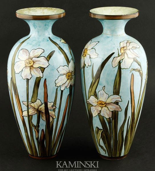 Pair of Bennett Pottery Vases: John Bennett (American 1840-1907), pair of pottery vases, hand-decorated, blue ground with white floral design, both signed in blue underglaze on underside, 11 1/4"h x 3 3/4"dia (mouth). One vase with