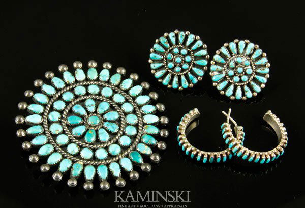 Suite of Zuni Turquoise and Silver Jewelry: Suite of Zuni turquoise and silver jewelry including; 2 1/4"dia sunburst pin having 3 rings of turquoise beads, matching pair of screw-back earrings and a pair of silver and turquoise loop earrings.
