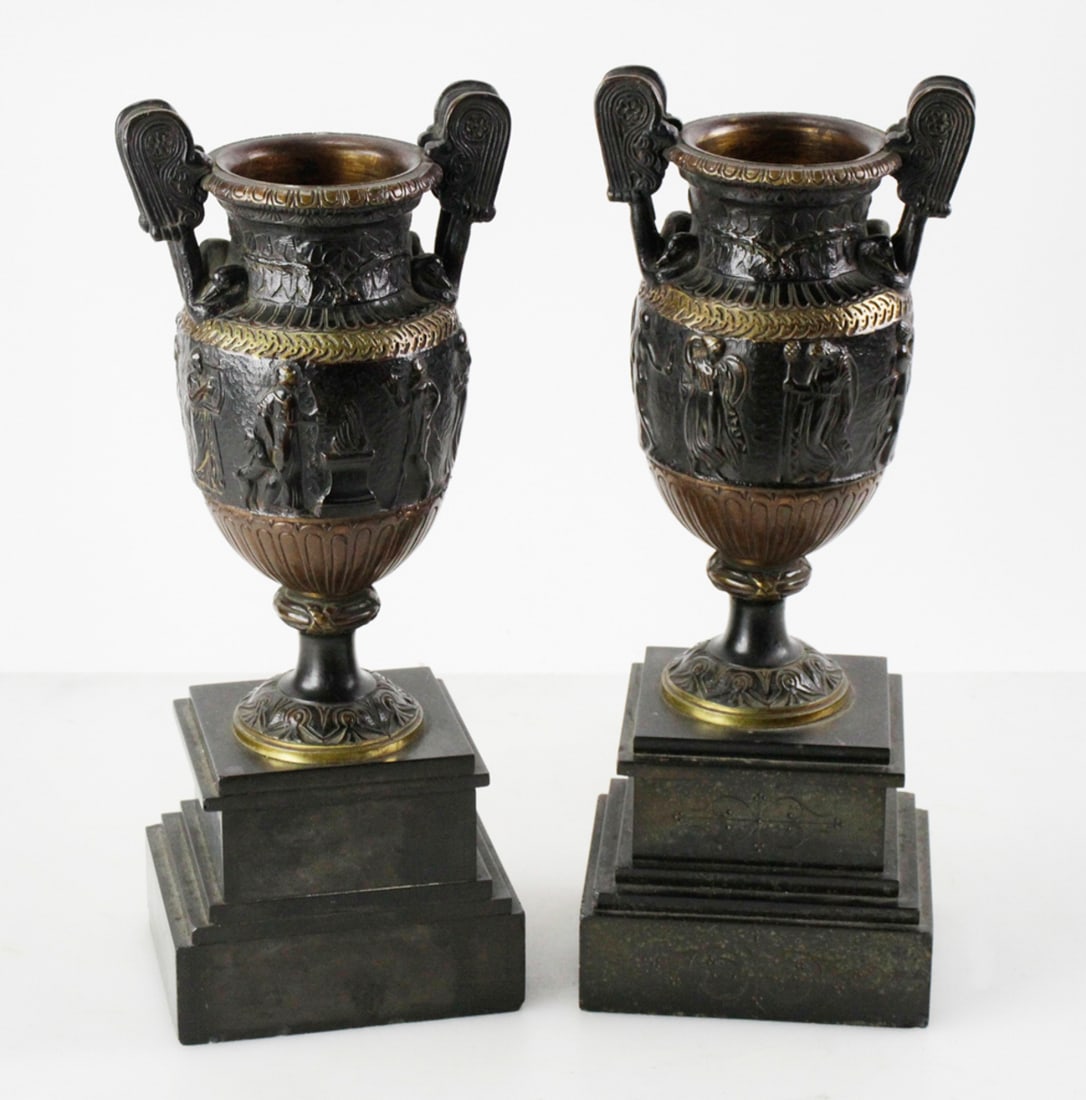 Pair of Egyptian Revival Mantel Urns: Pair of Bronze Egyptian Revival mantel urns, 14" H x 5 1/2" W x 4 1/2" D. Good condition with age-related finish wear on bases. Provenance: Southern Connecticut collection.