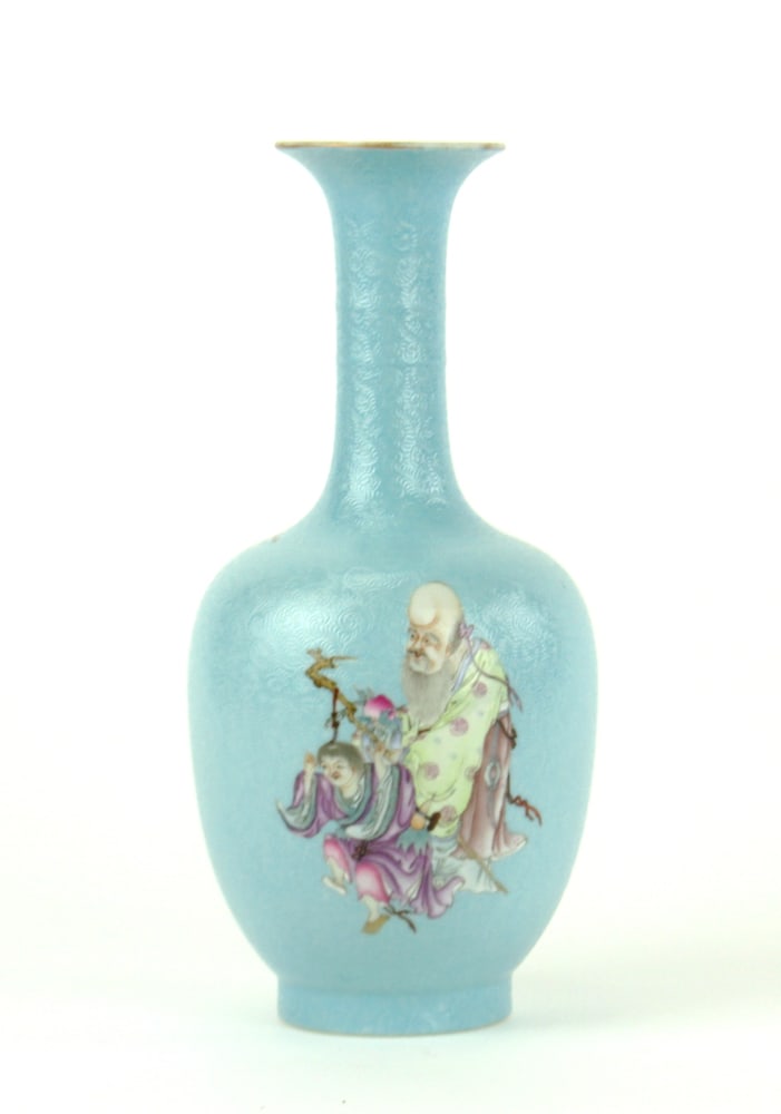 Chinese Famille Rose Vase: Chinese 19th century porcelain vase with long neck formed body, decorated with Famille Rose Shou-star playing with boy over turquoise ground, gilt on the rim. The base bears an apocryphal red Qianlong