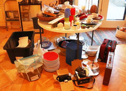 Large Table Lot, Dishes, Cameras, Utensils, Silverplate: Large table lot, including Royal Worcester, serving dishes, Mark Cross briefcase, Nikon cameras, brass pot, napkins, frogs, serving utensils, large box of silverplate, 200 pieces of flatware.