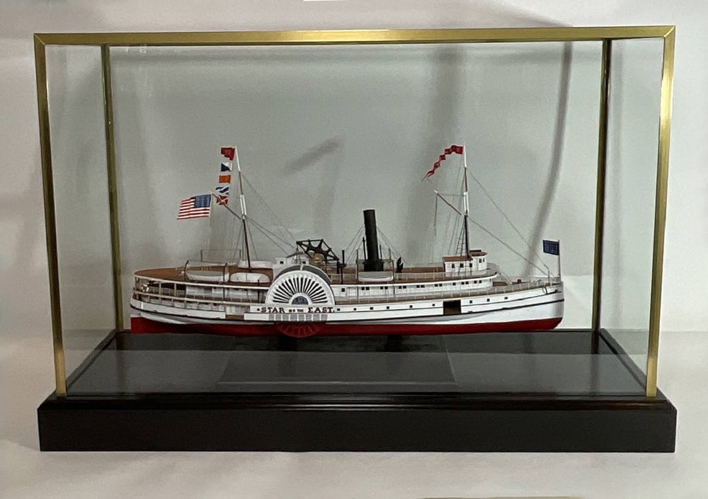 Ship Model of Paddle Steamer "Star of the East": Scale ship model of the nineteenth century paddle steamer "Star of the East". "Star of the East" was a coastal steamship ferry between Gardiner, Maine and Boston. Fitted to a glass case. 32" H x 12" W